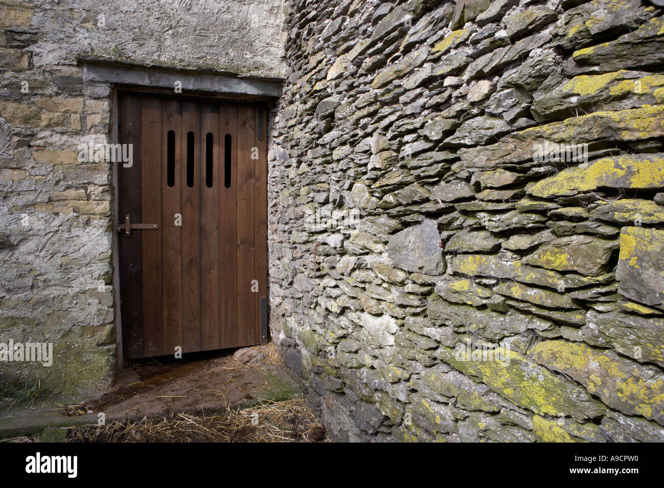 barn in Cumbria traditional door with ventilation slits Stock Photo