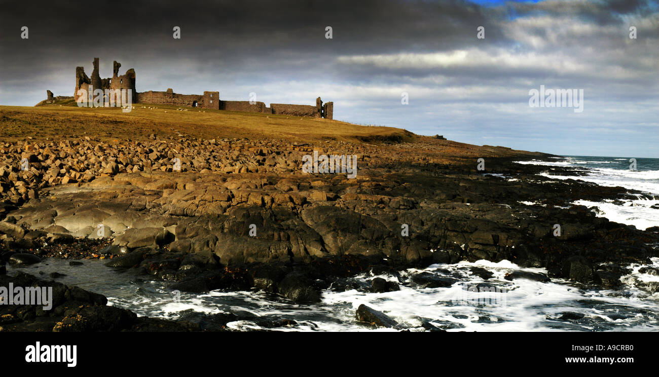 The ruins of Dunstanburgh Castle on the Northumberland coast near Craster Stock Photo