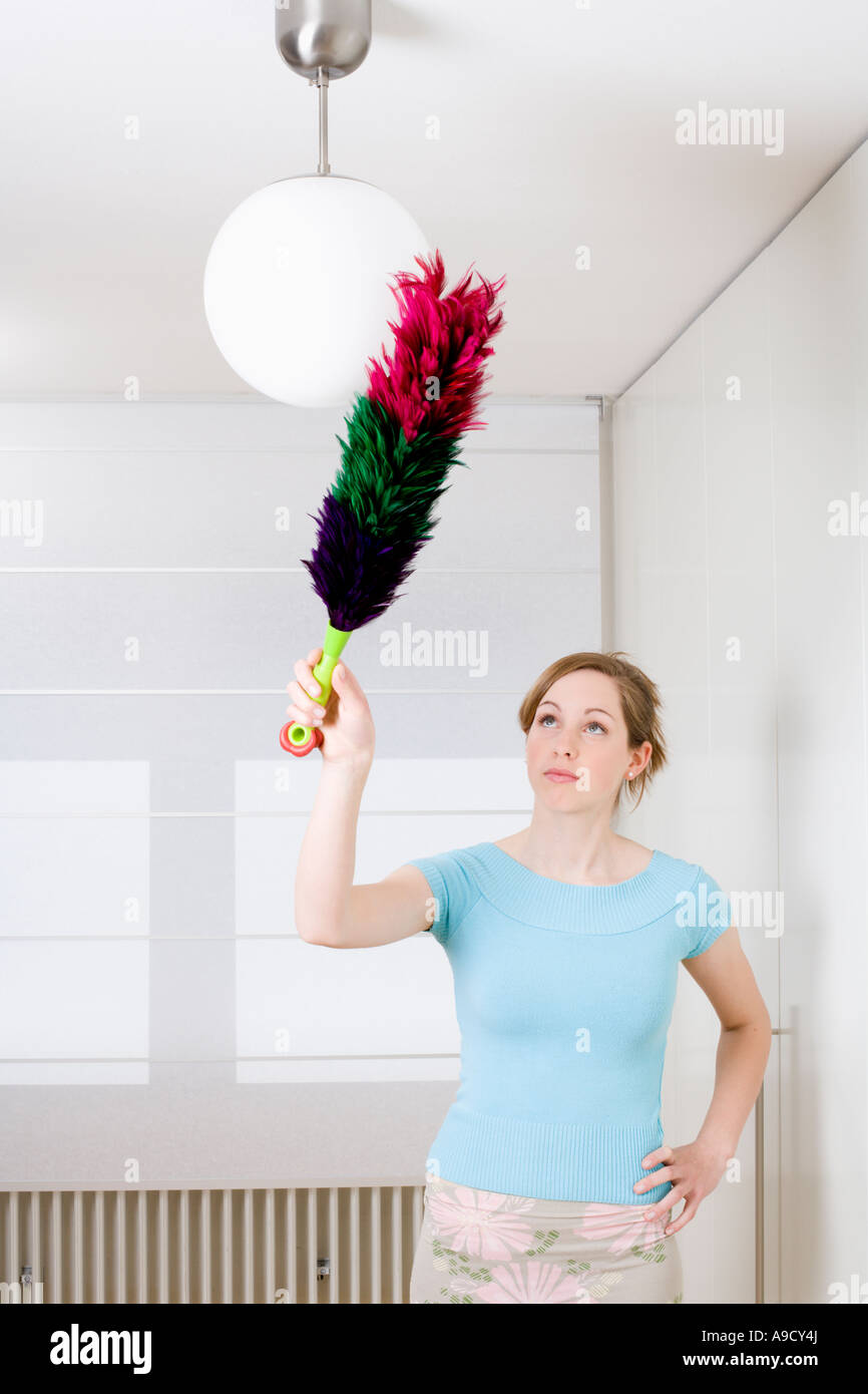 Girl with feather duster hires stock photography and images Alamy