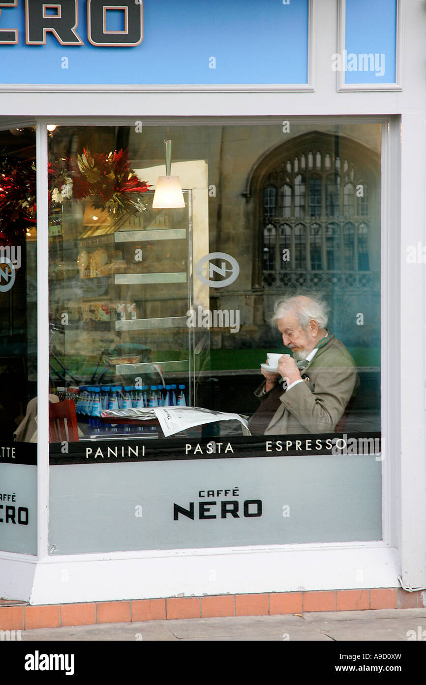 cafe shop caffe nero front window display elderly man drink coffee Stock Photo