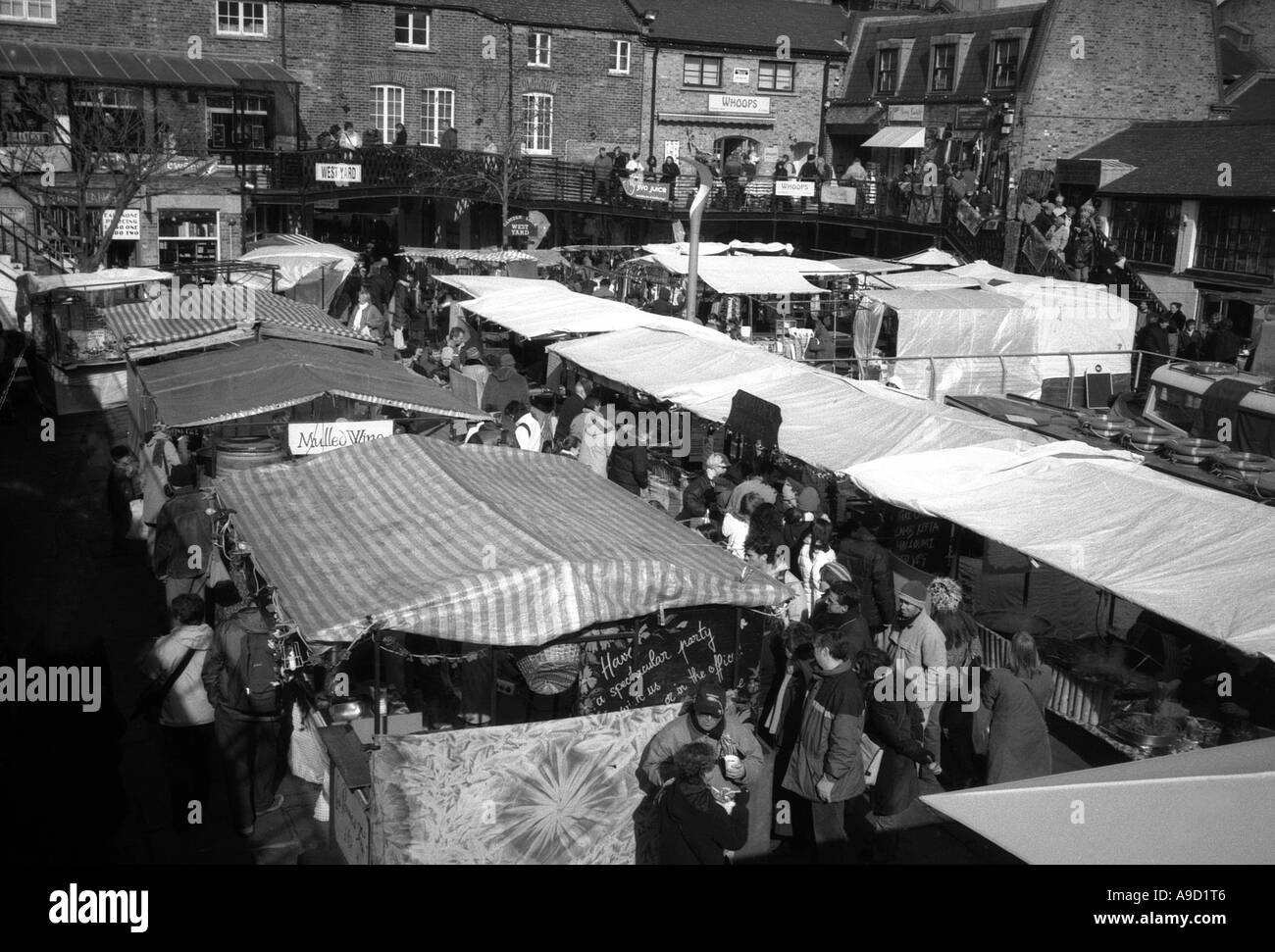 View of busy lively colourful shops & stands Camden Lock Market Camden Town London England United Kingdom Europe Stock Photo
