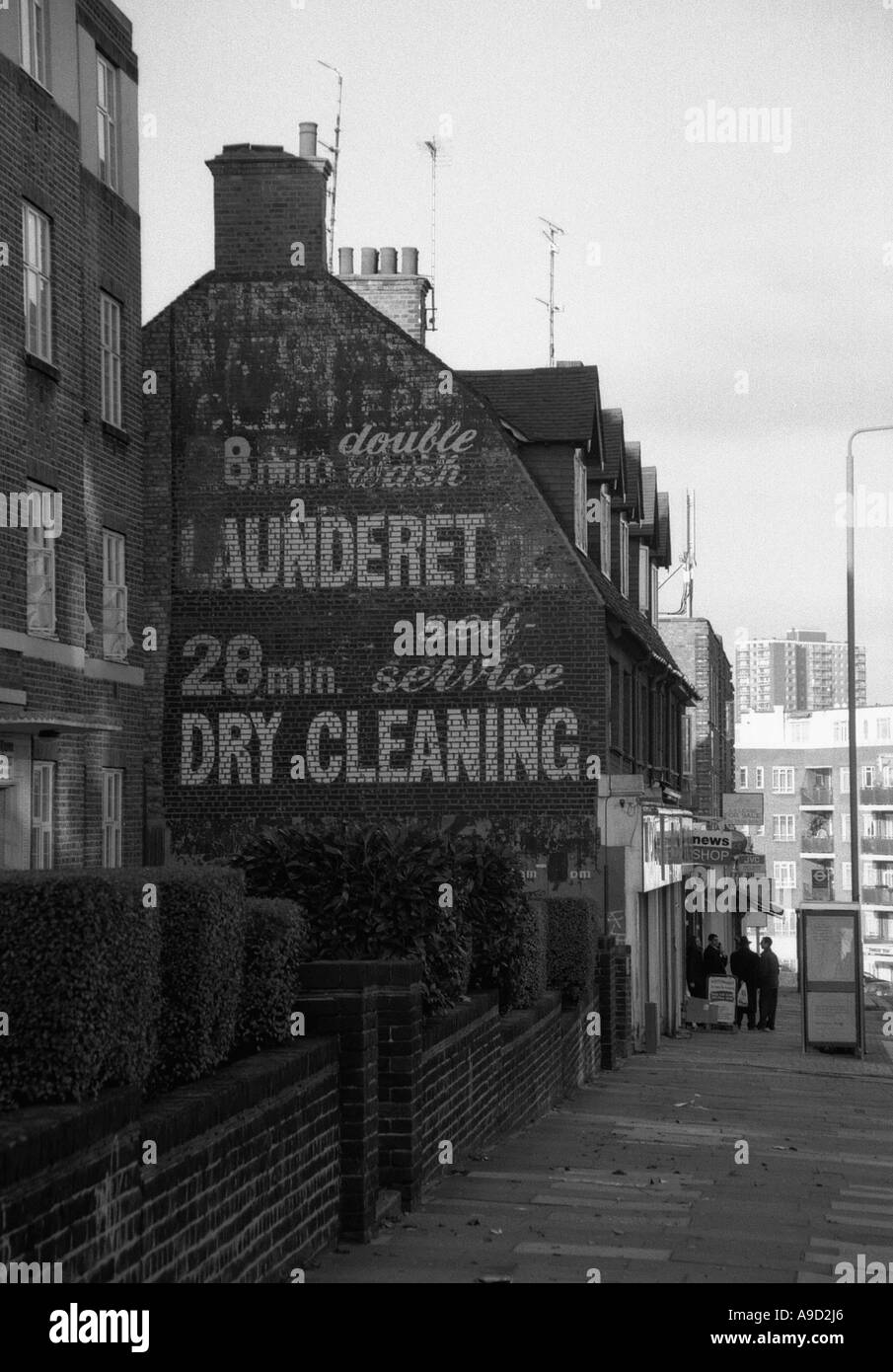 View of old laundrette laundry shop dry cleaning in High Street Golders