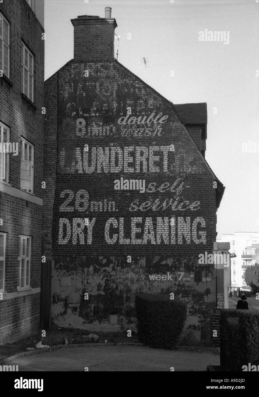 View of old laundrette laundry shop dry cleaning in High Street Golders