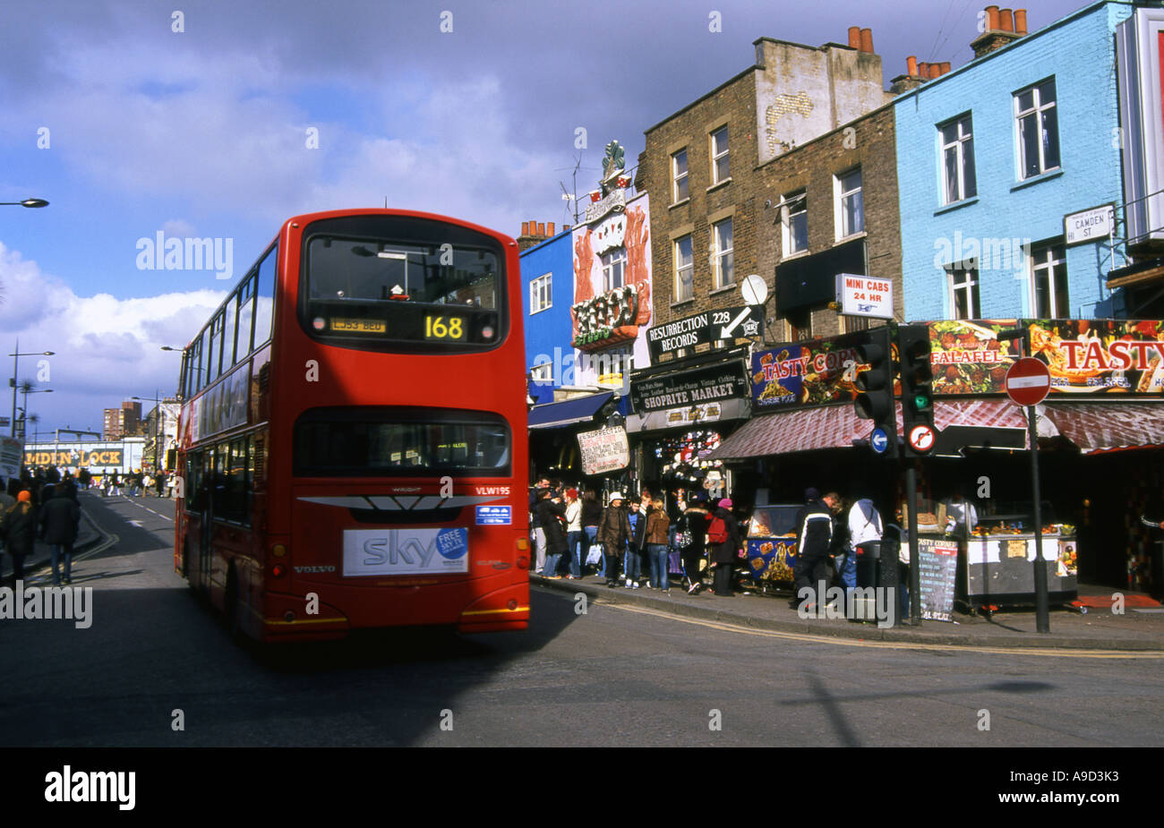 View of busy lively colourful street shops & Double Decker in Camden Town London England United Kingdom Europe Stock Photo