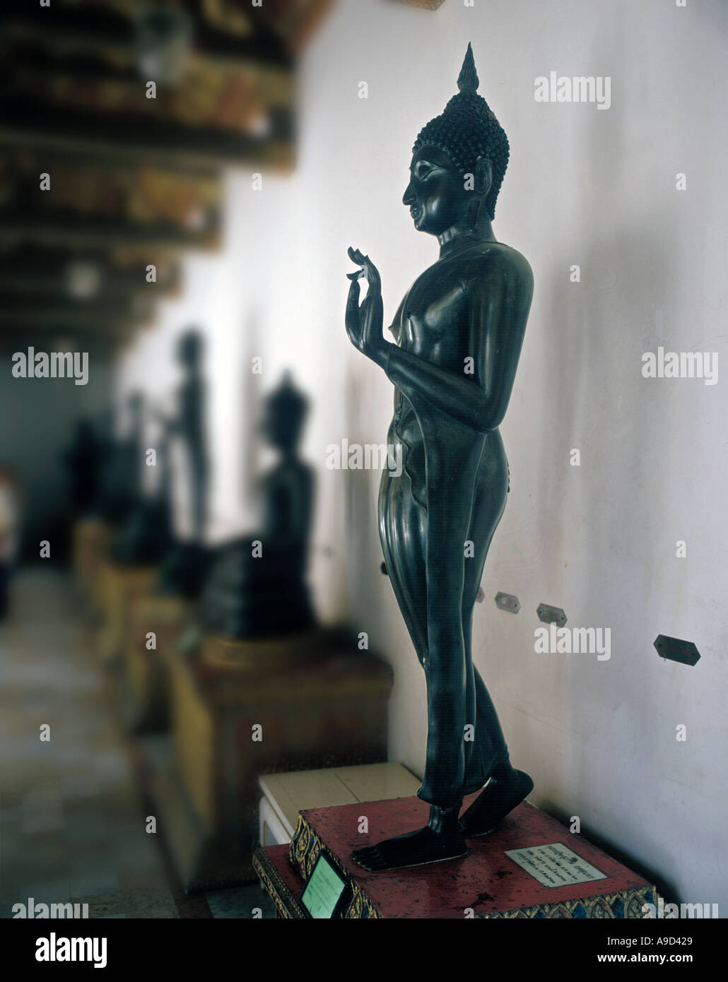 Statue of Walking Buddha at Wat Benchamabophit Dusitvanaram (Marble Temple), Bangkok, Thailand Stock Photo