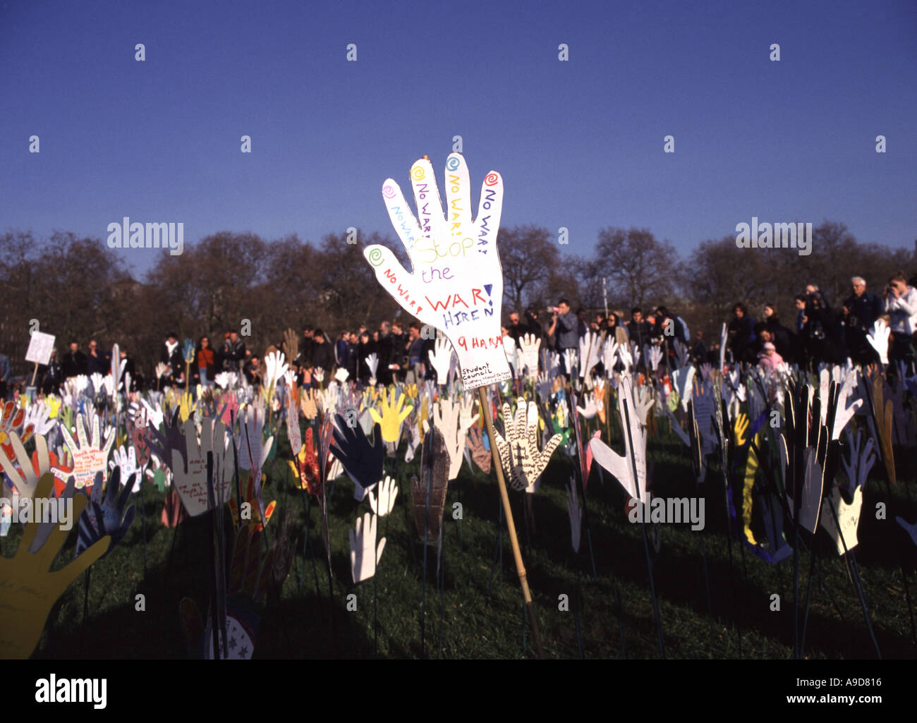 Sea of hands decorated by children planted in Hyde Park London at the 2003 protests against the war in Iraq Stock Photo