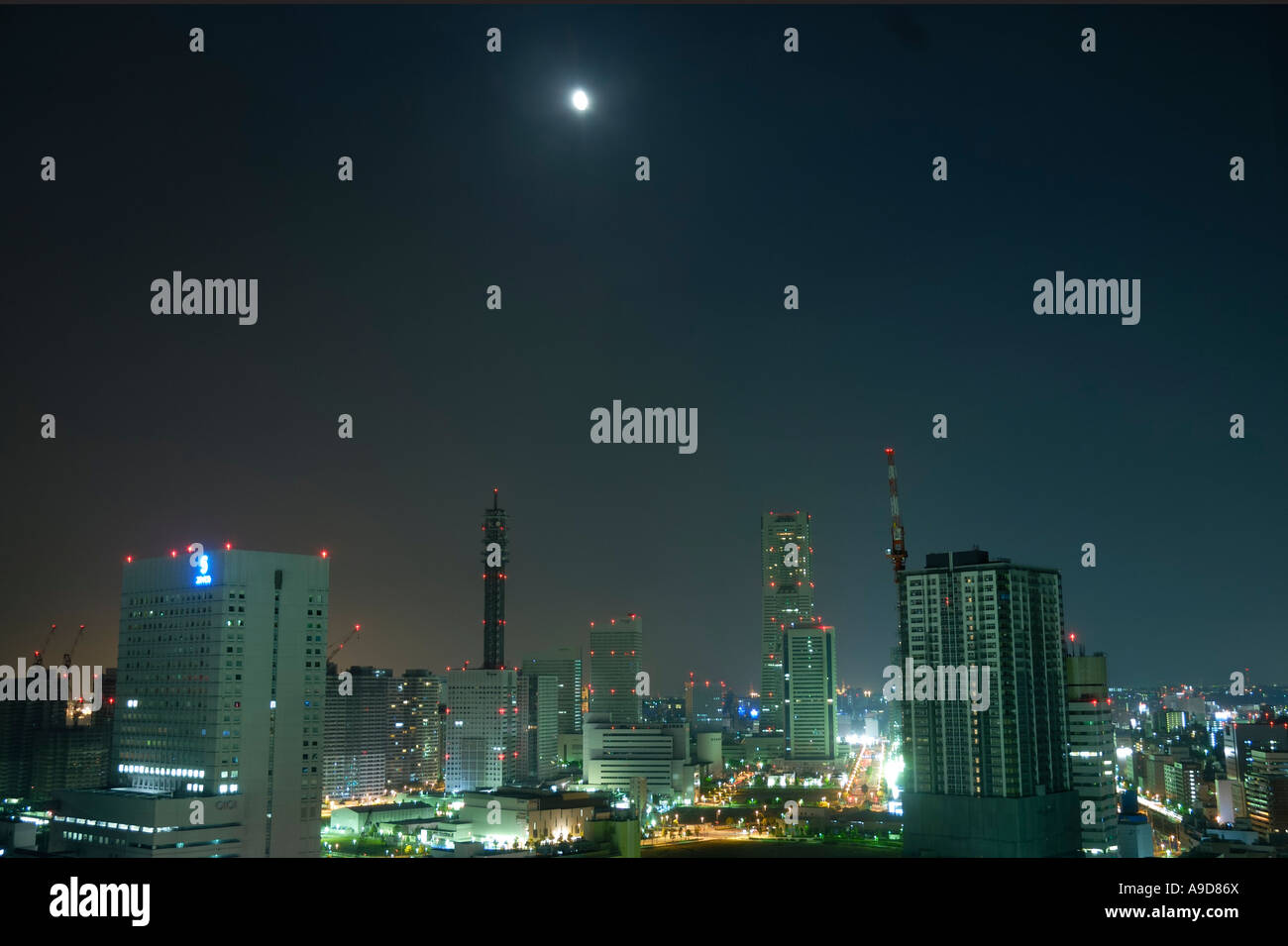 Moon over Minato Mirai 21 district of Japanese Yokohama city Stock Photo