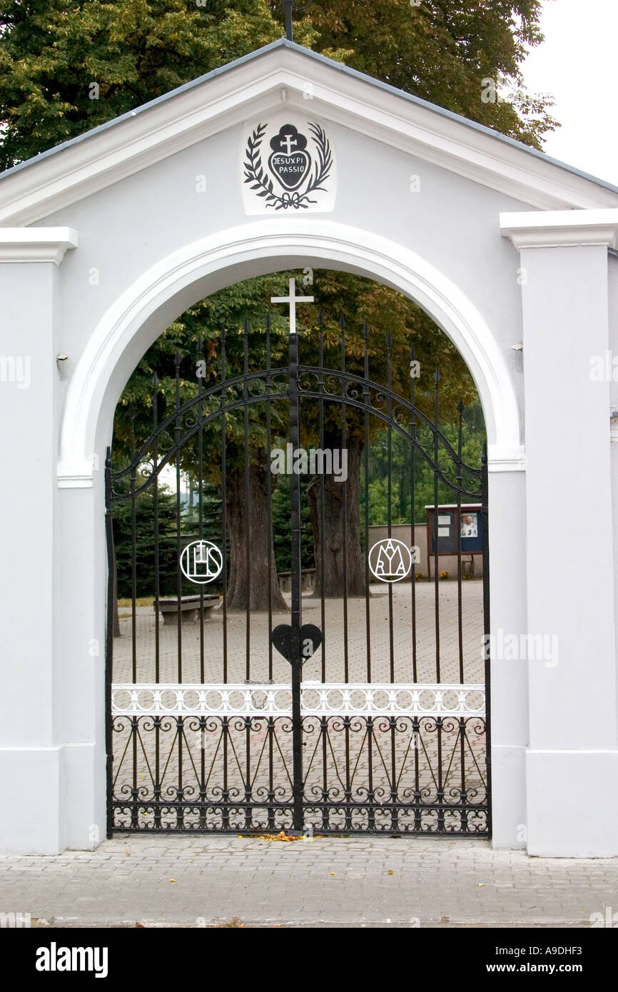 Closed gates into a Polish churchyard. Rawa Mazowiecka Poland Stock Photo