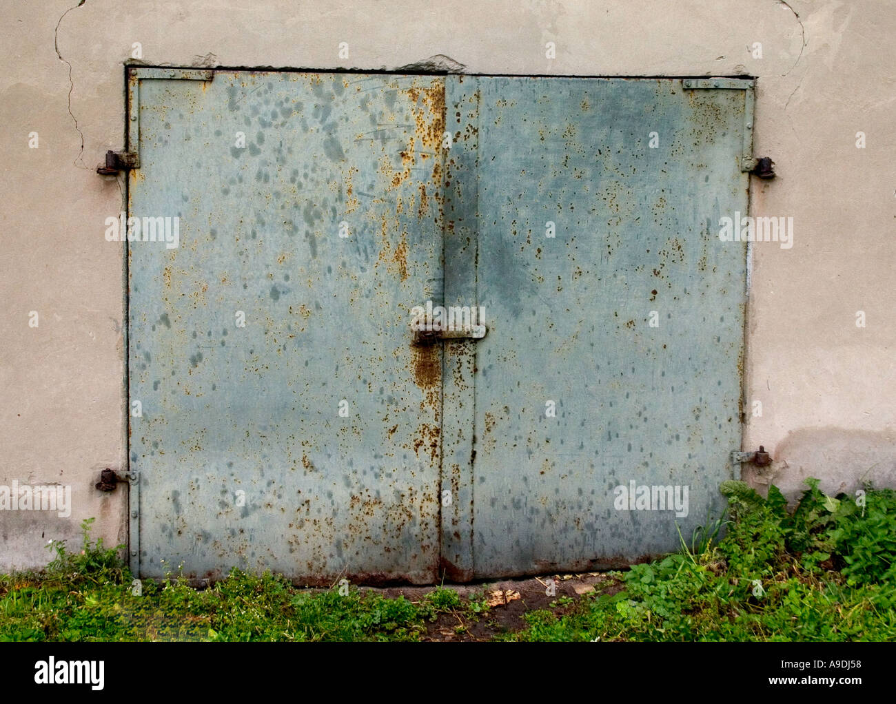 Rusted weathered metal storage room door. Rawa Mazowiecka Poland Stock Photo