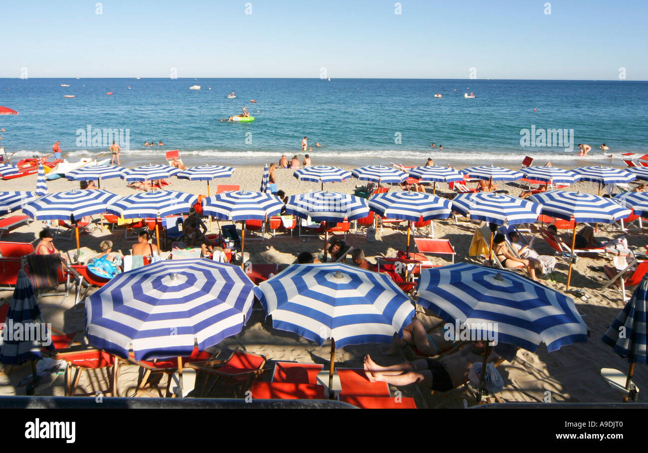 Umbrellas on busy beach in Spotorno Italy Stock Photo