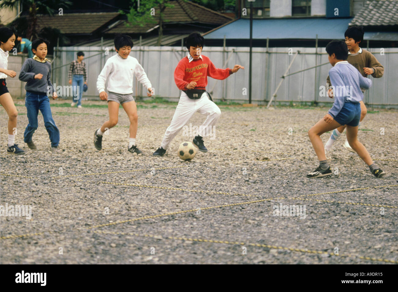 Boys playing football Tokyo Japan Stock Photo Alamy