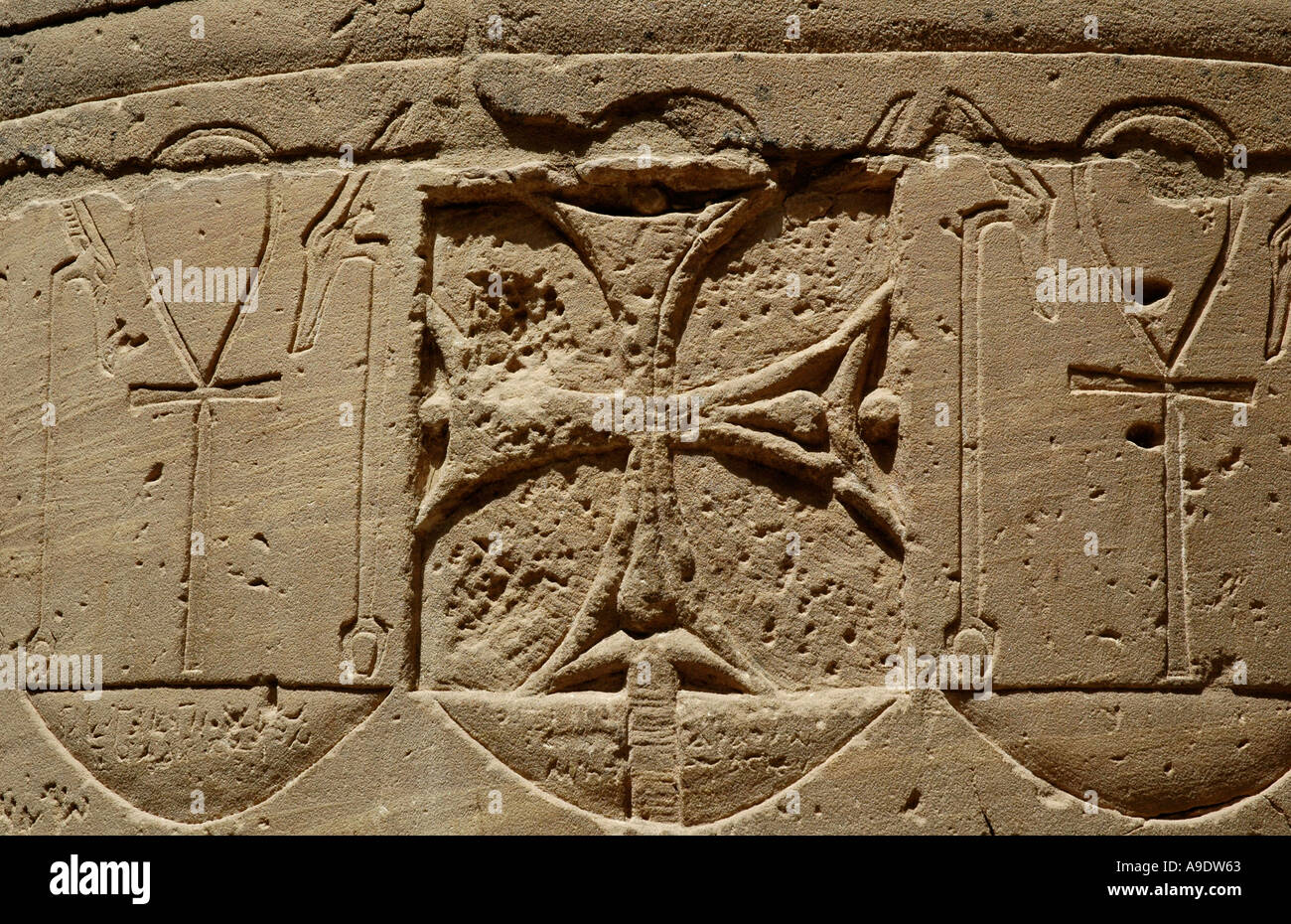 Christian Cross superimposed on column carvings at Phillae Temple Egypt Stock Photo
