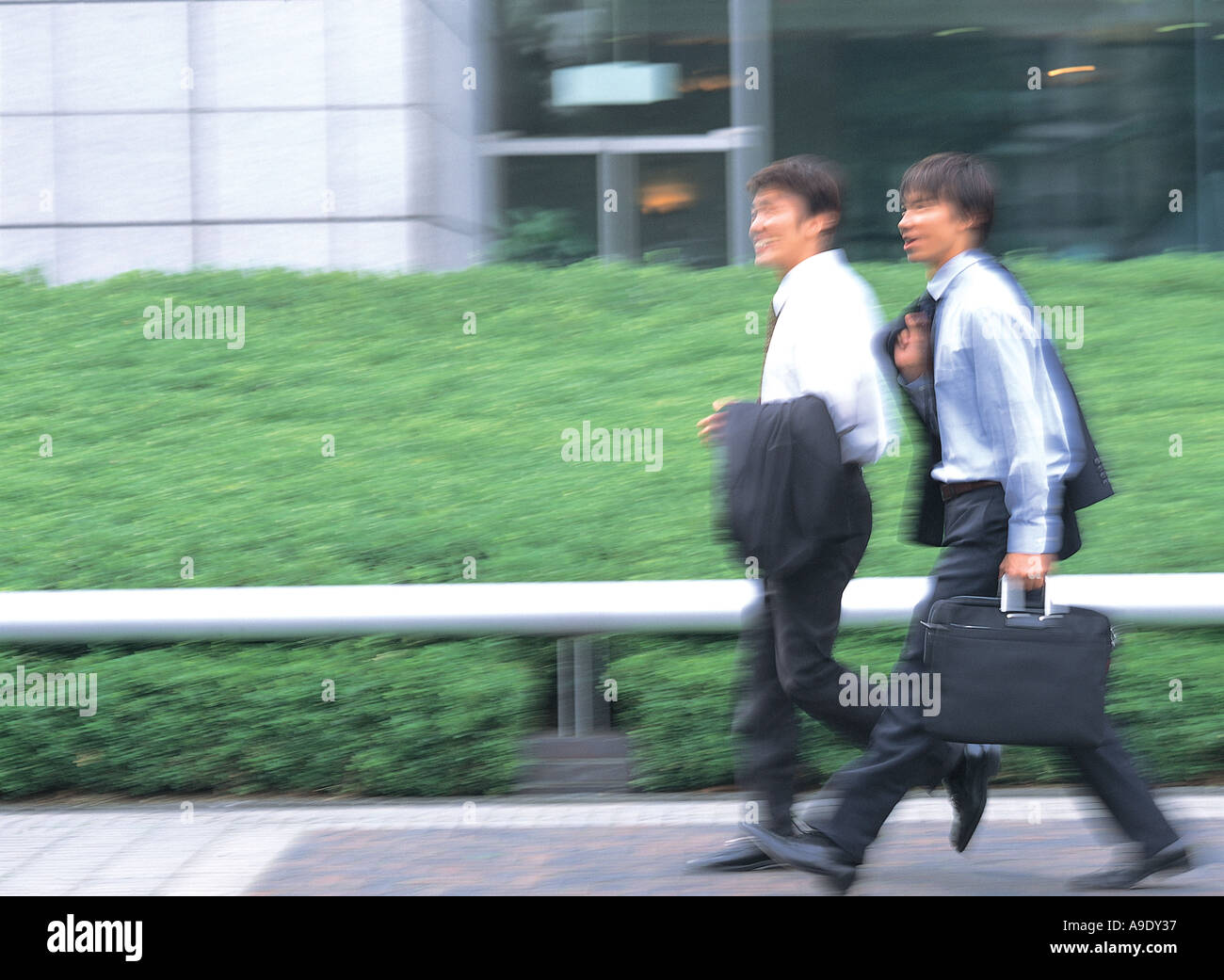 Two japanese businessmen walking hi-res stock photography and images ...