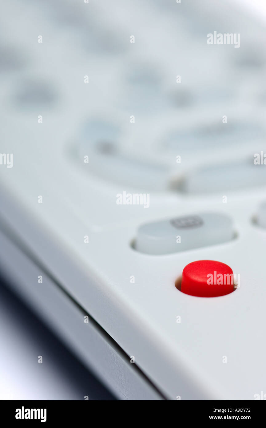Red interactive button on a tv remote control Stock Photo