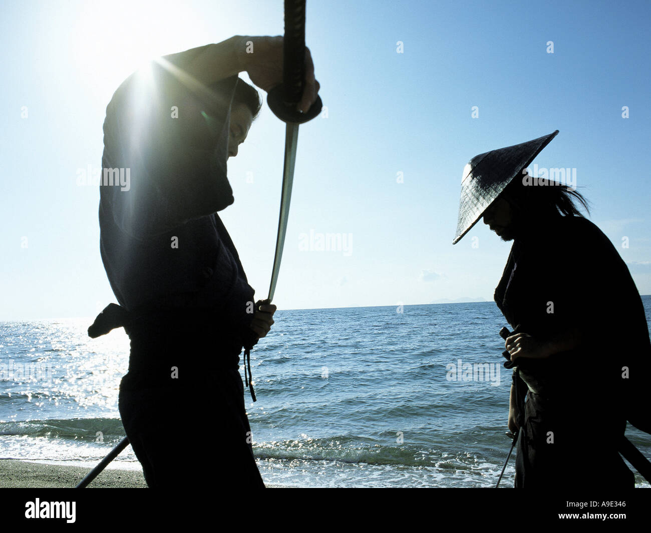 Samurai with raised sword hi-res stock photography and images - Alamy