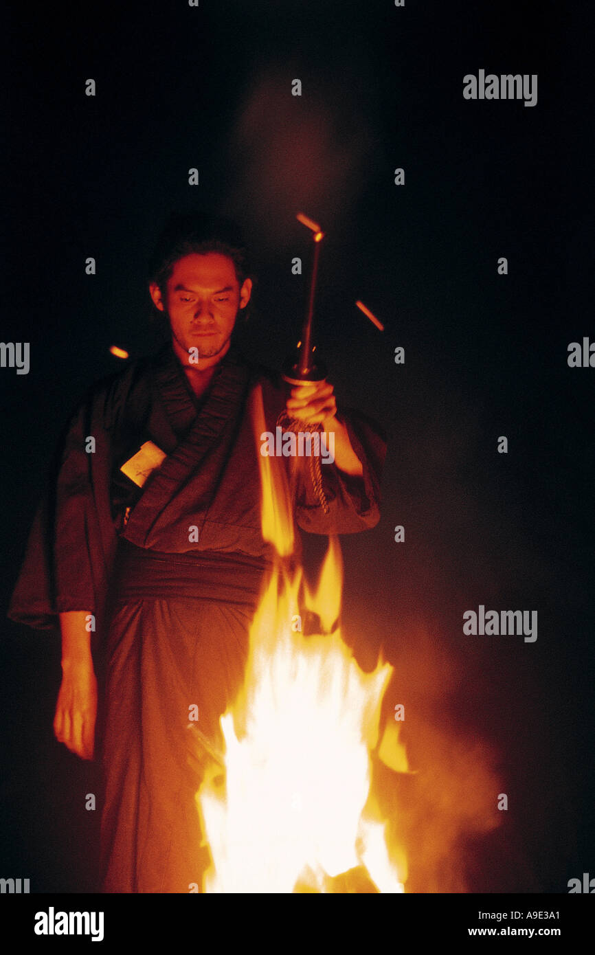 Samurai with raised sword hi-res stock photography and images - Alamy