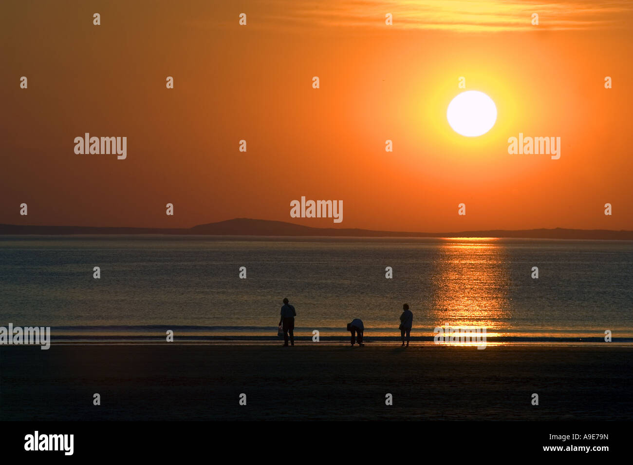 Family On Beach At Broadhaven At Sunset Pembrokeshire Dyfed West Wales 