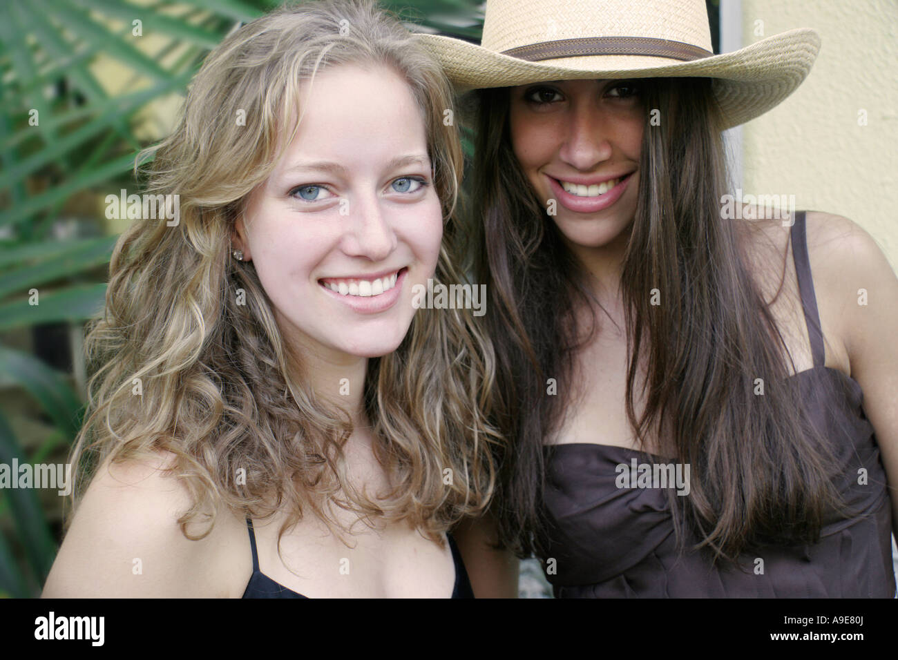 Two Long Haired Young Women One Blonde The Other A Brunette