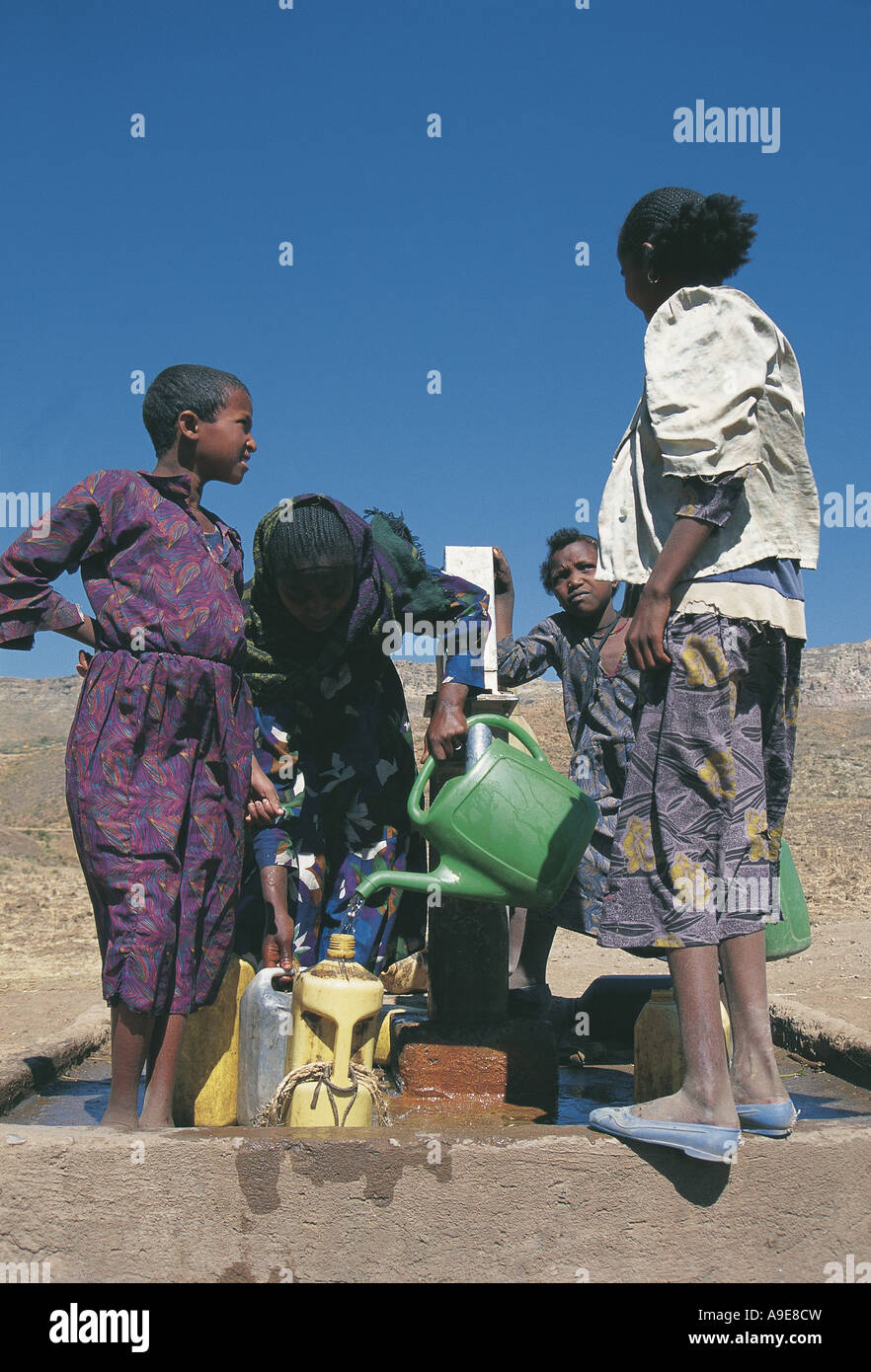 United Nations installed water pump point Women collecting water Mekele Ethiopia Stock Photo