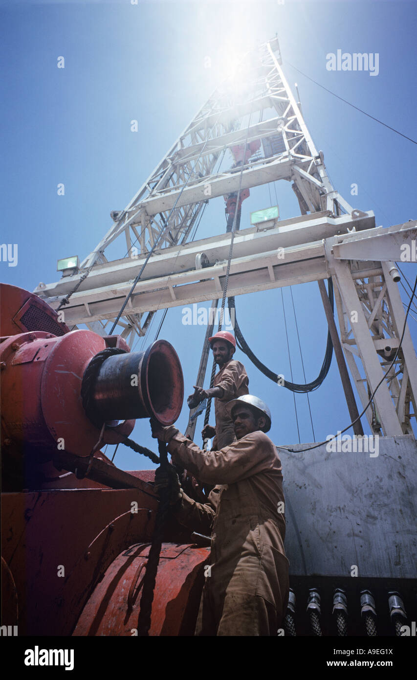 Saudi Arabia. Ras Tanura oil Refinery. Men work at rig at HQ of Saudi Aramco the American co, set up by King Abdul Aziz(1938). Stock Photo