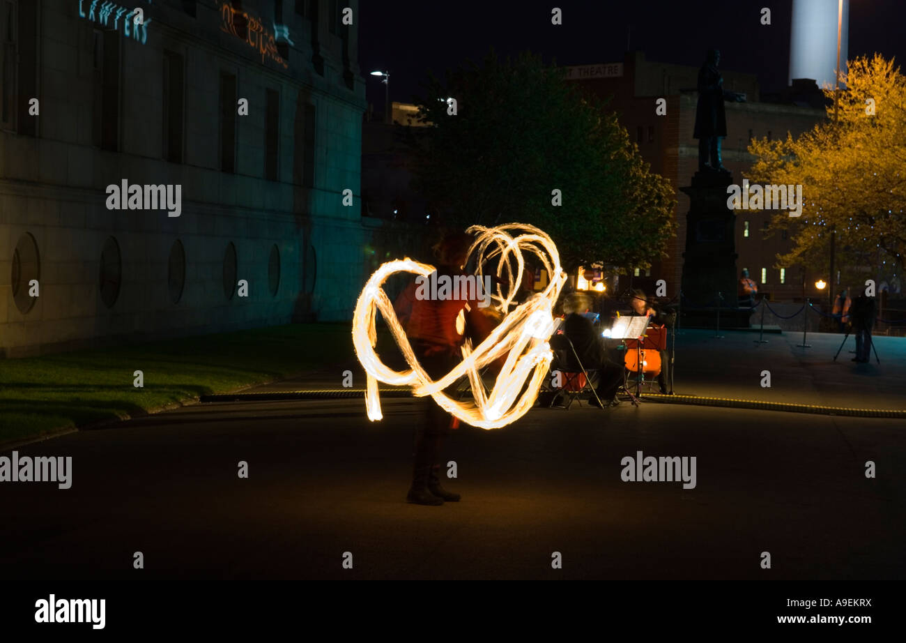 Fire Juggler at Night in the gardens of St Georges hall Liverpool European Capital of Culture 2008 Stock Photo