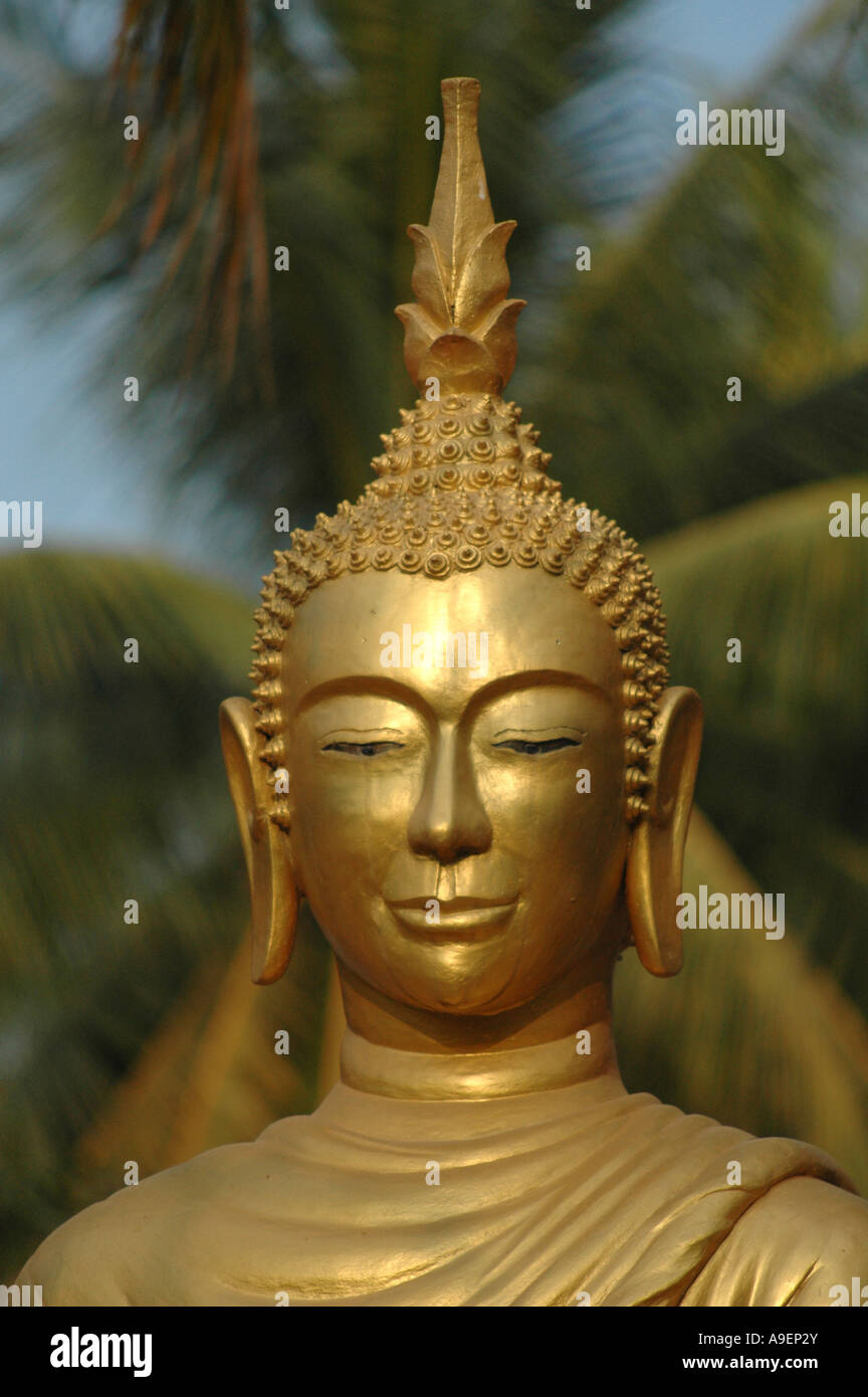 Gold clad statue of buddha in Luang Prabang, northern Laos. Stock Photo