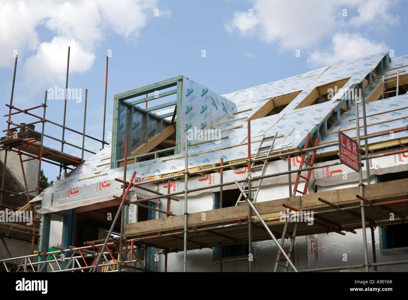 Insulation boards on a new house prior to the roofing and windows being fitted Stock Photo