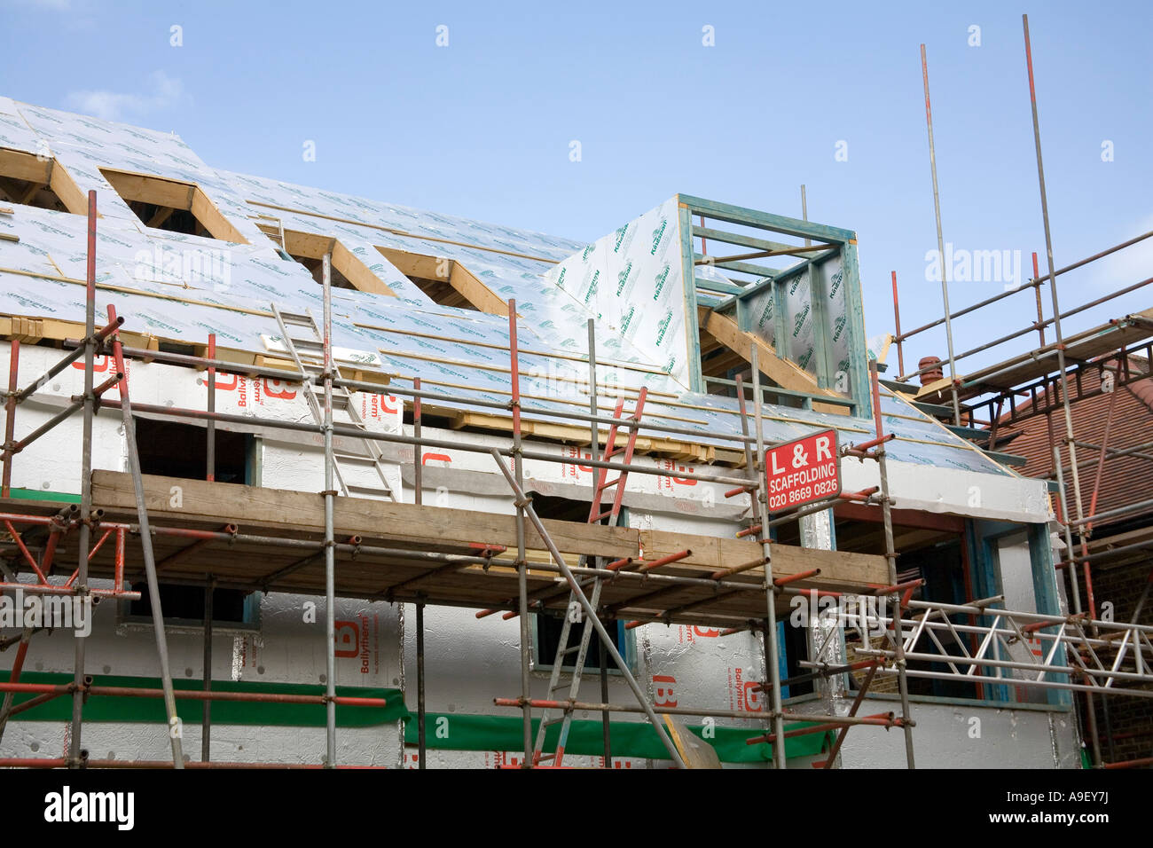 Insulation boards on a new house prior to the roofing and windows being fitted Stock Photo