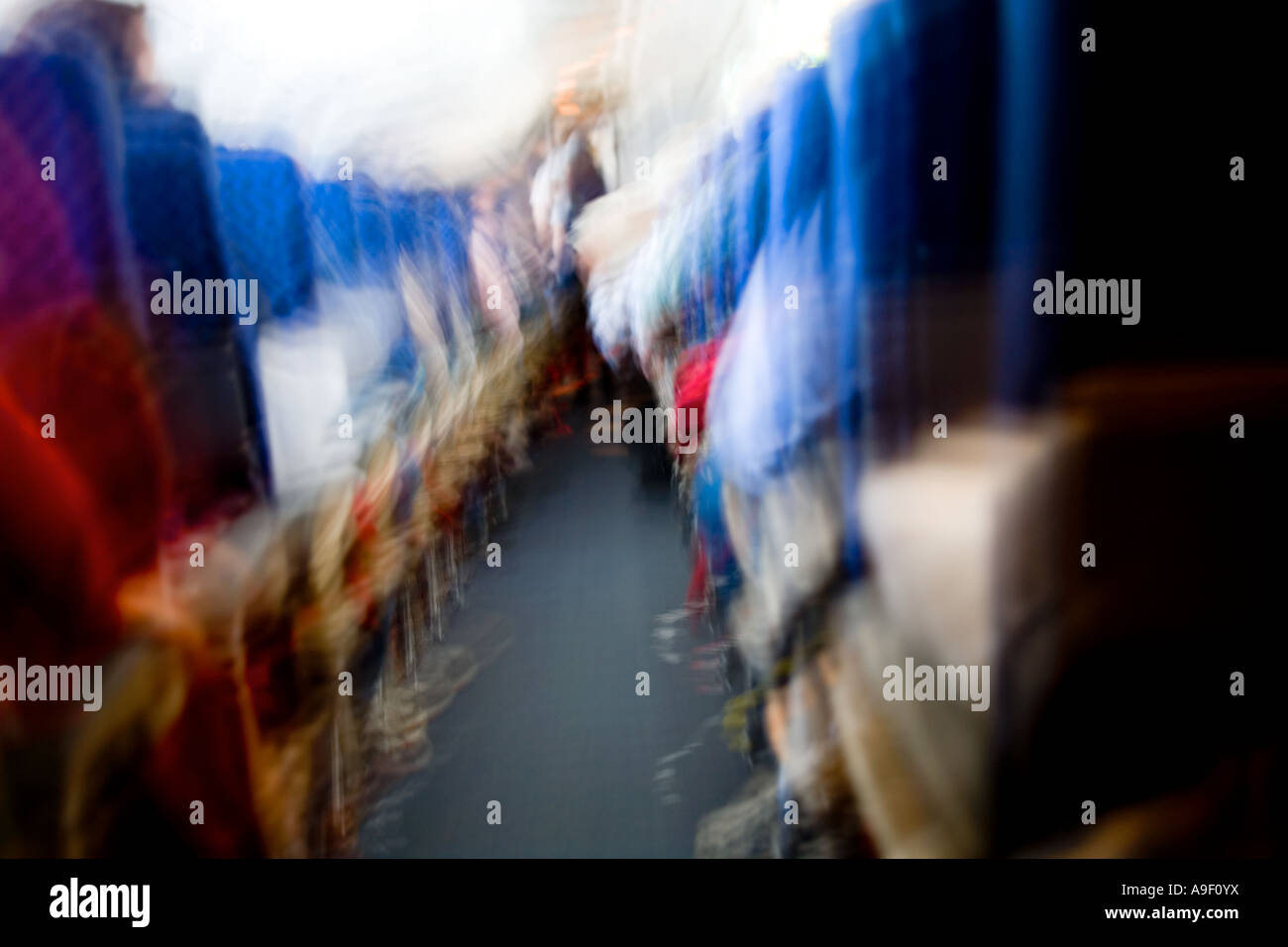 Blurred movement inside the cabin of a Boeing 757 airliner in flight. Stock Photo