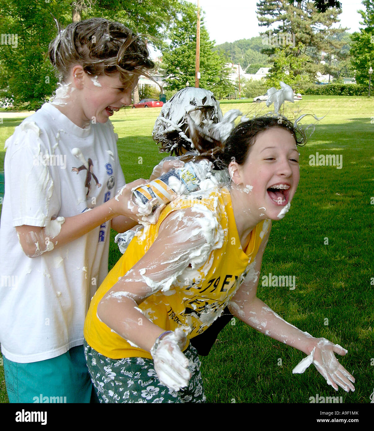 kids having a shaving cream battle Stock Photo Alamy