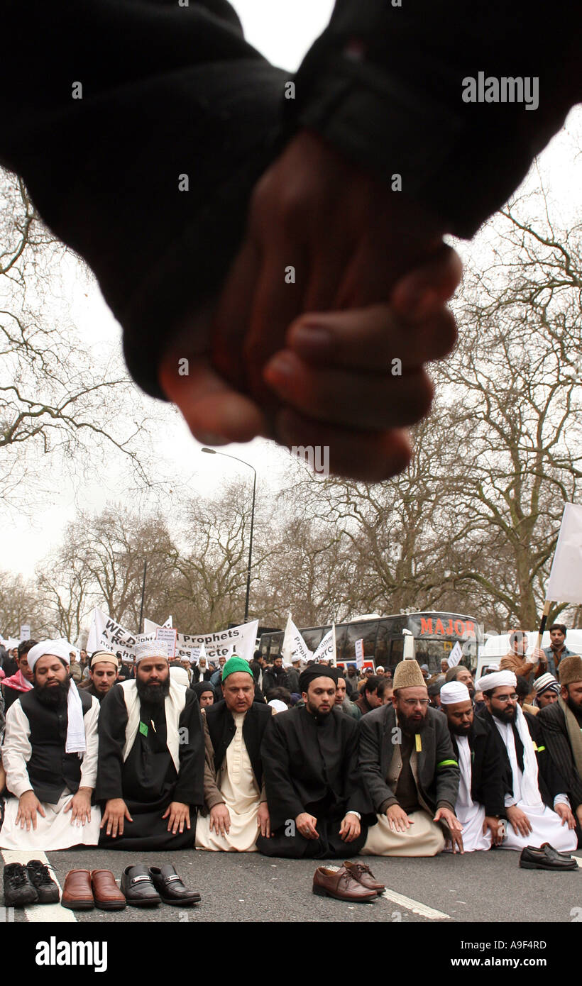 Muslims pray during a march trough central London in response to the publication of cartoons of Prophet Mohammed, 18 Febr. 2006 Stock Photo