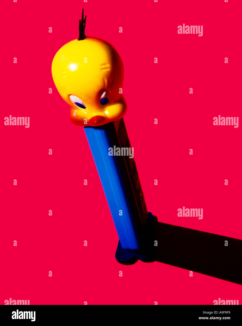 Tweety bird Pez dispenser on red background Stock Photo