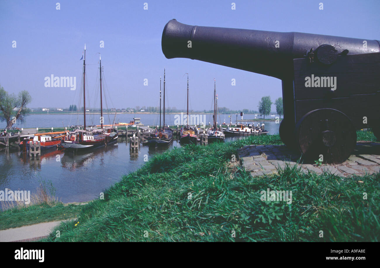 Historic gun overlooking the harbour in Woudrichem the Netherlands Stock Photo