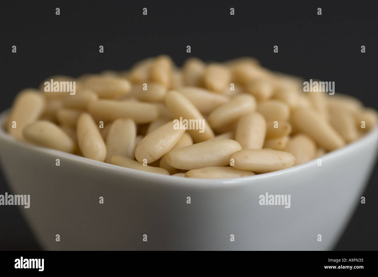 Organic pinenuts in a bowl Stock Photo