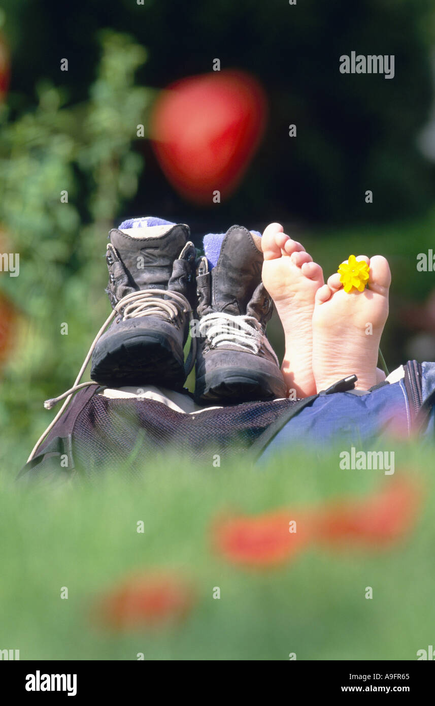 hiker having a break, hiking shoes taken off Stock Photo Alamy