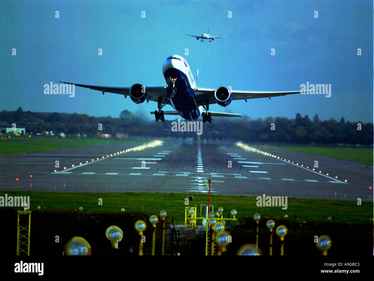 BA Boeing 757 jet taking off at Gatwick as another plane flies overhead Stock Photo
