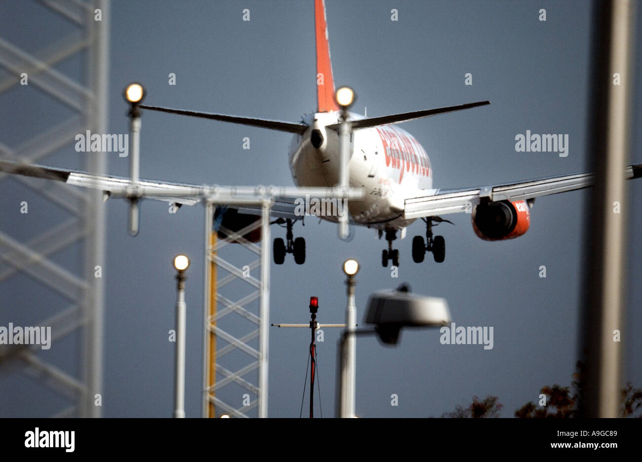 An EasyJet plane flying low over the runway at Stanstead Stock Photo