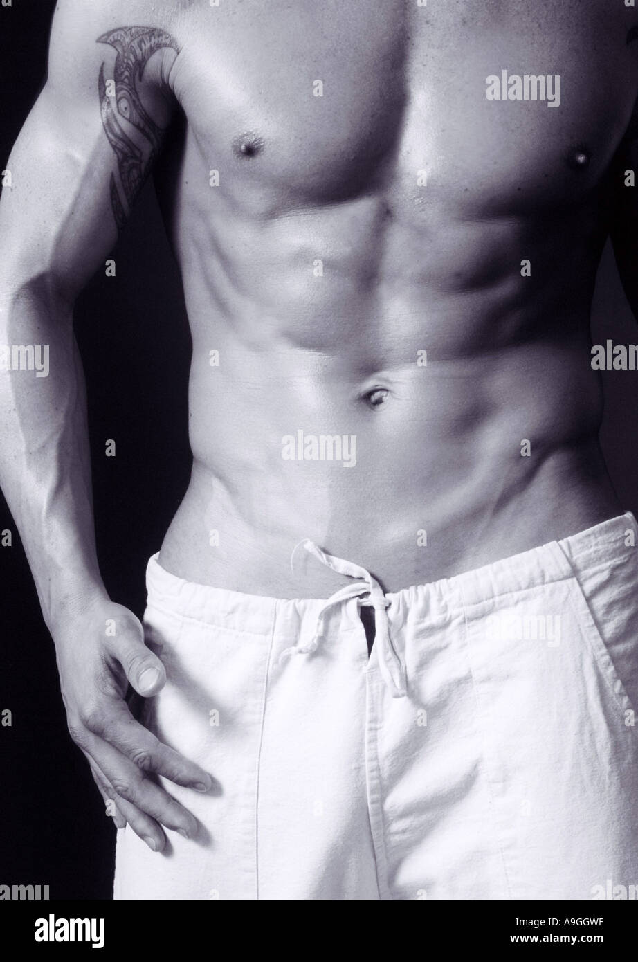 people, human beings, humans (Homo sapiens sapiens), muscular man, with nude upper part of his body, washboard stomach, wearing Stock Photo