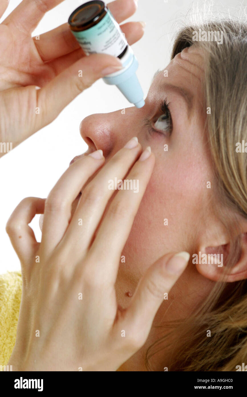 woman applying eye-drops. Stock Photo