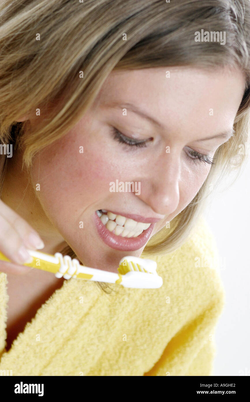 woman brushing her teeth. Stock Photo
