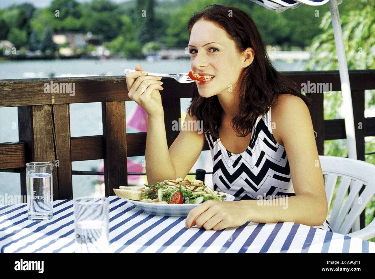 young woman eating a salat Stock Photo