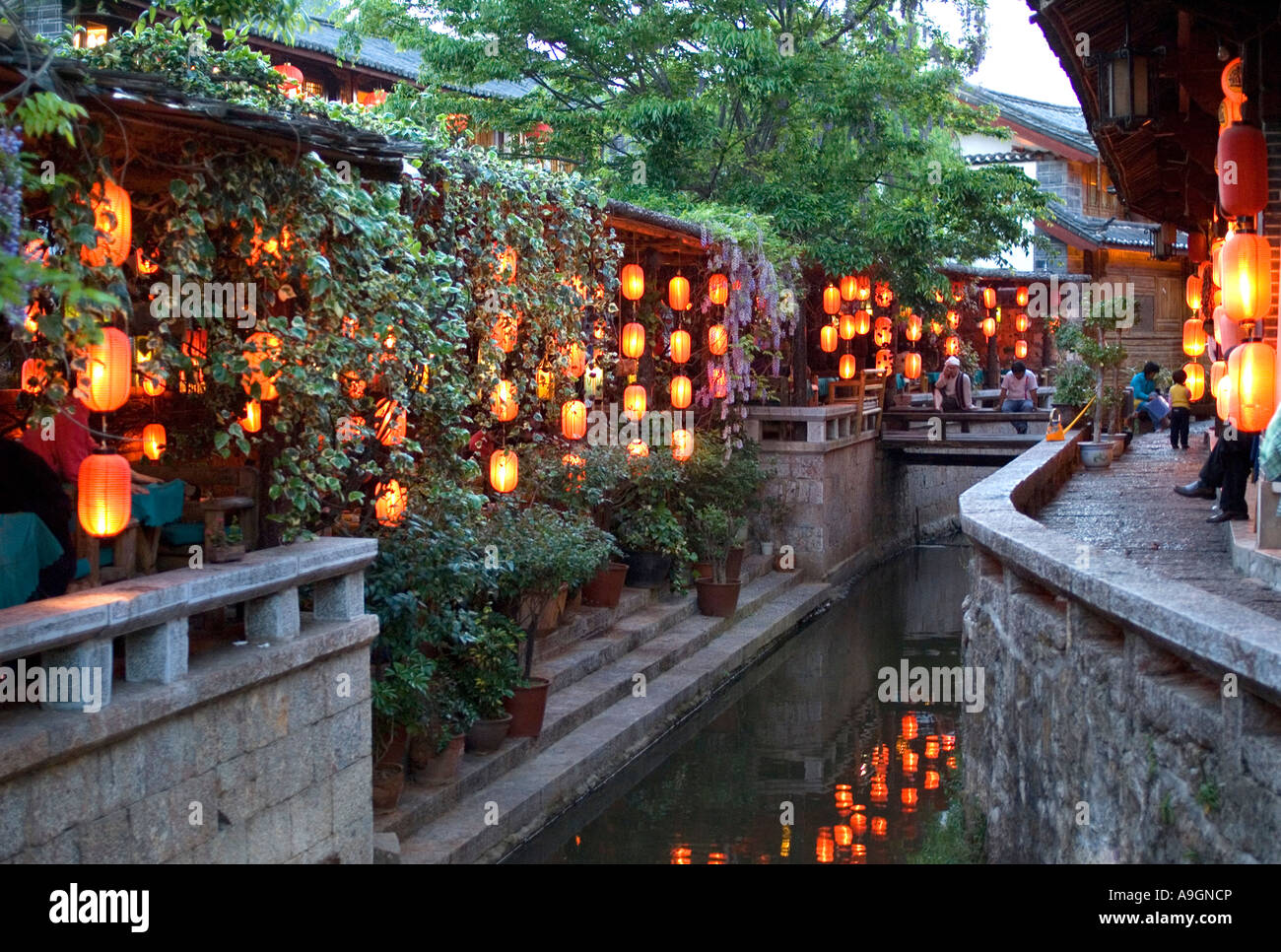 Lijiang Old Town restaurant lanterns in evening along canal, Yunnan ...