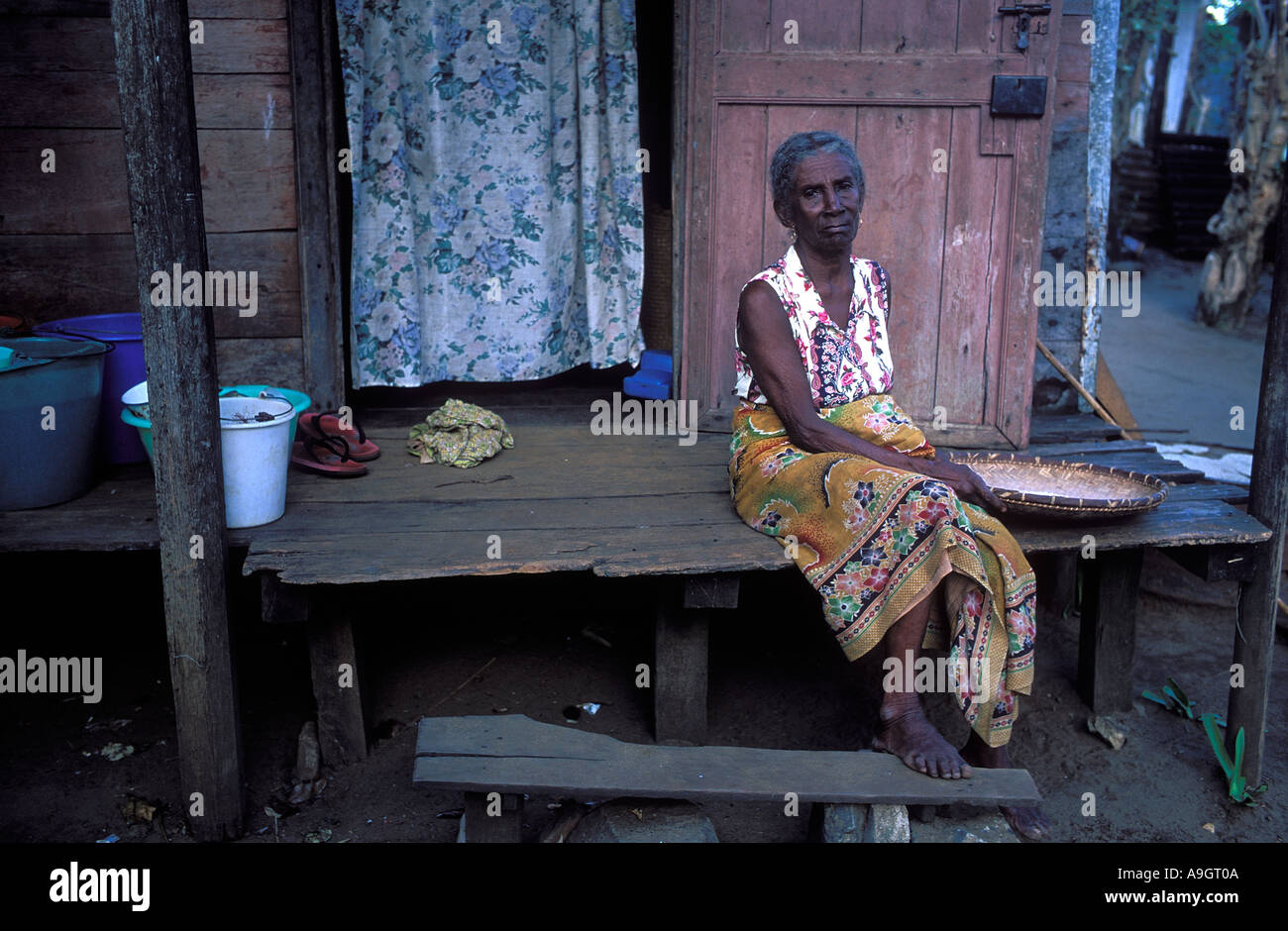 Old Lady Sitting on Porch Antalaha Madgascar Stock Photo - Alamy