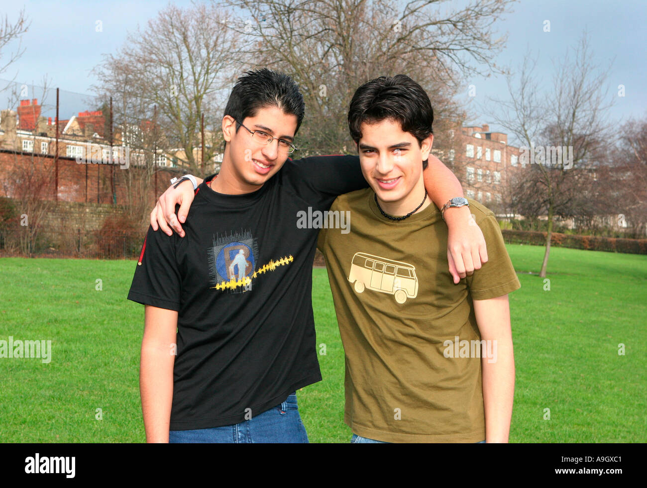 Two boys arms around each other hi-res stock photography and images - Alamy