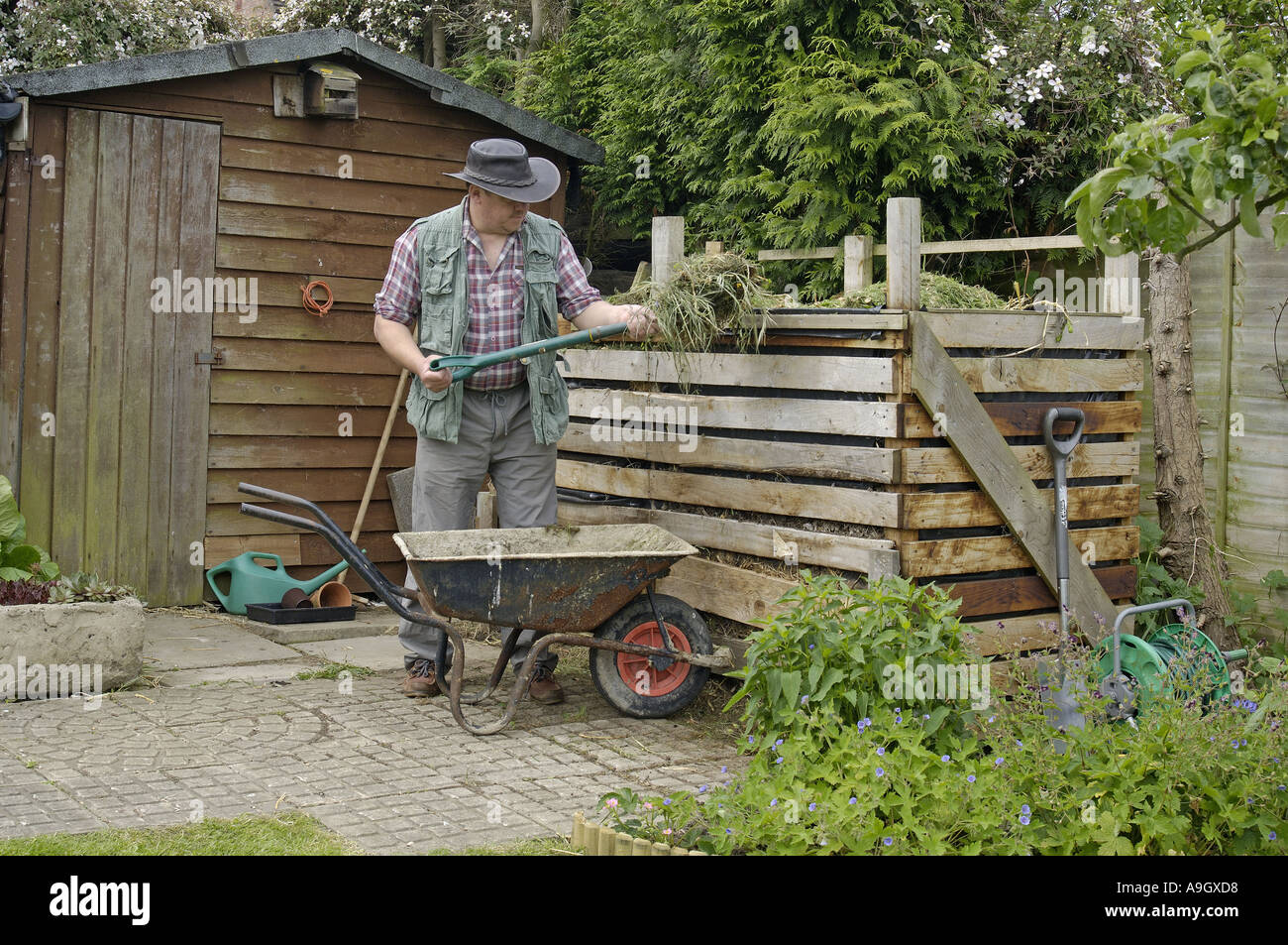 Filling up the compost heap Stock Photo