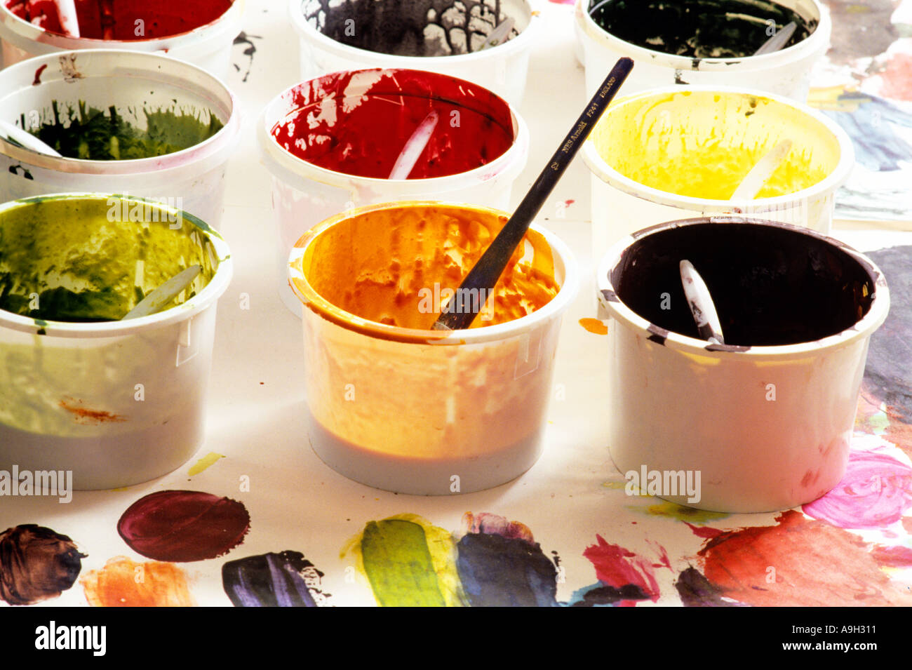 Nine tubs of paint Stock Photo Alamy