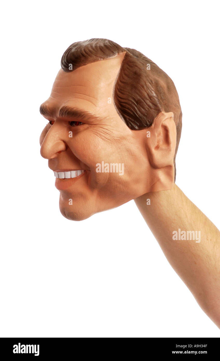 President George W Bush Mask on outstretched arm Stock Photo