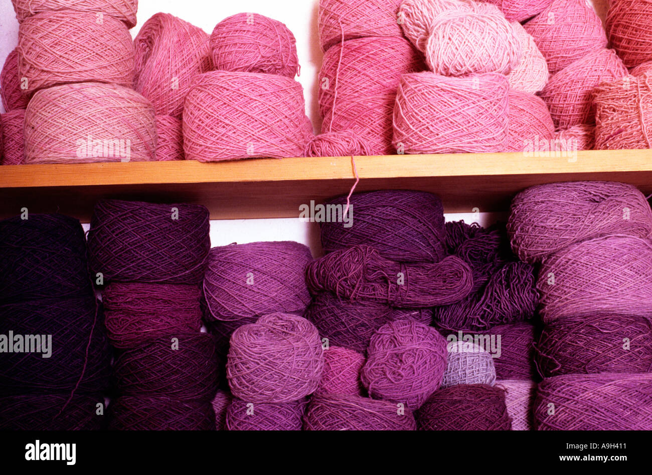Balls of pink and purple wools The Natural Dye Company Stock Photo