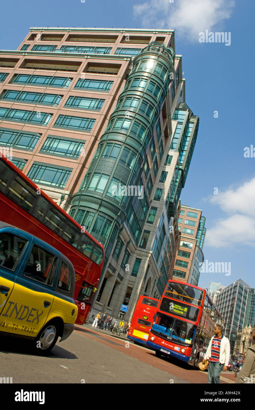 Buses and taxi travelling through Liverpool Street in London Stock Photo