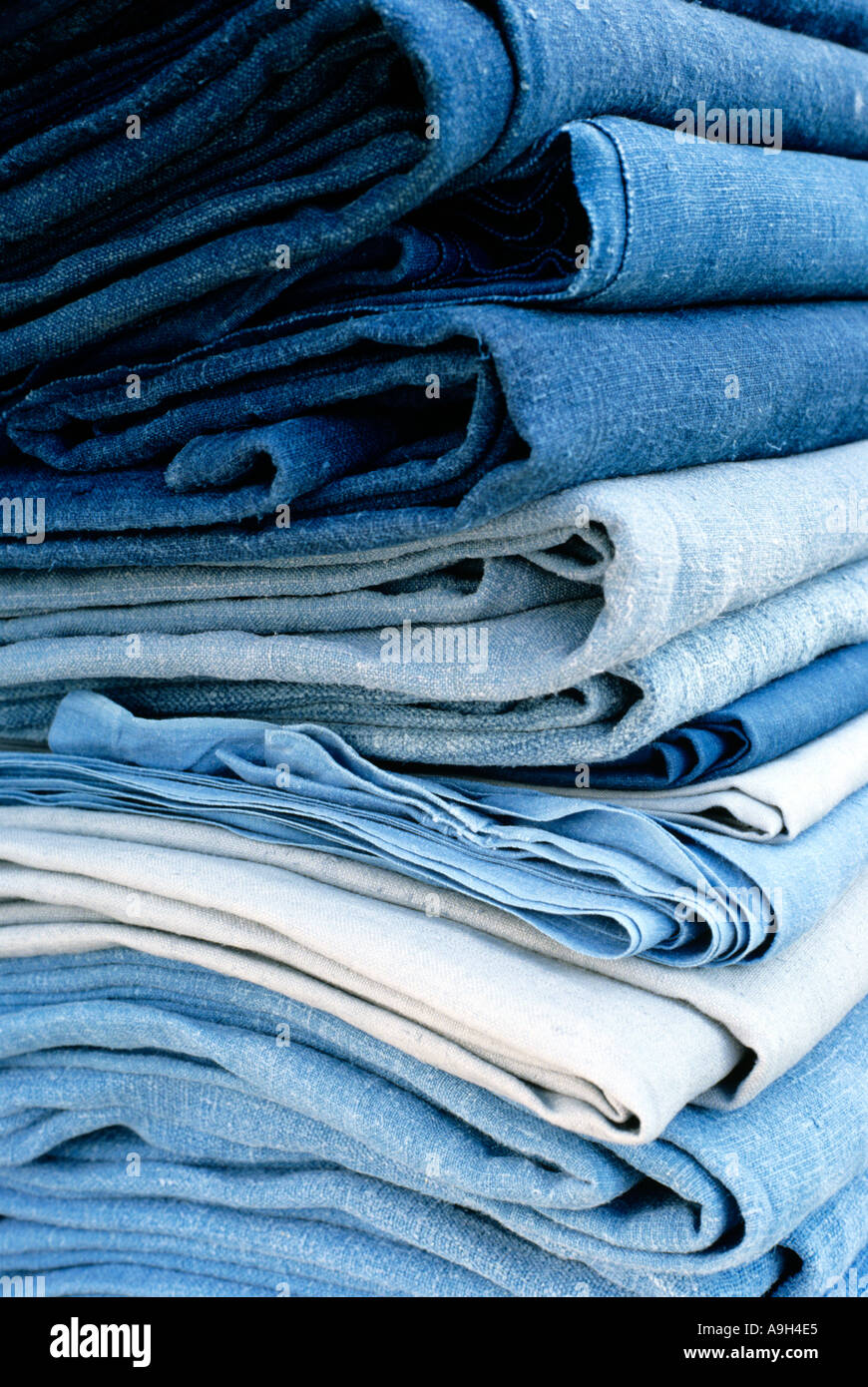 A pile of indigo dyed blue linen sheets by Polly Lyster Stock Photo Alamy